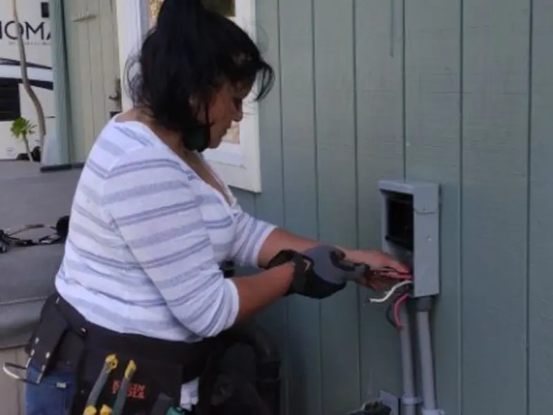 Licensed electrician wiring an exterior subpanel in Green Tree
